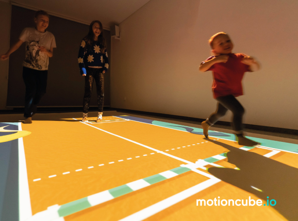 Children playing interactive games on the floor — fun and entertainment